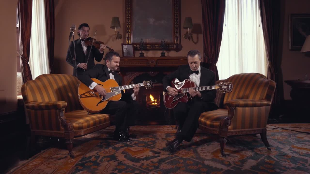 Vinny Valentino performing with his ensemble in a fireside parlor